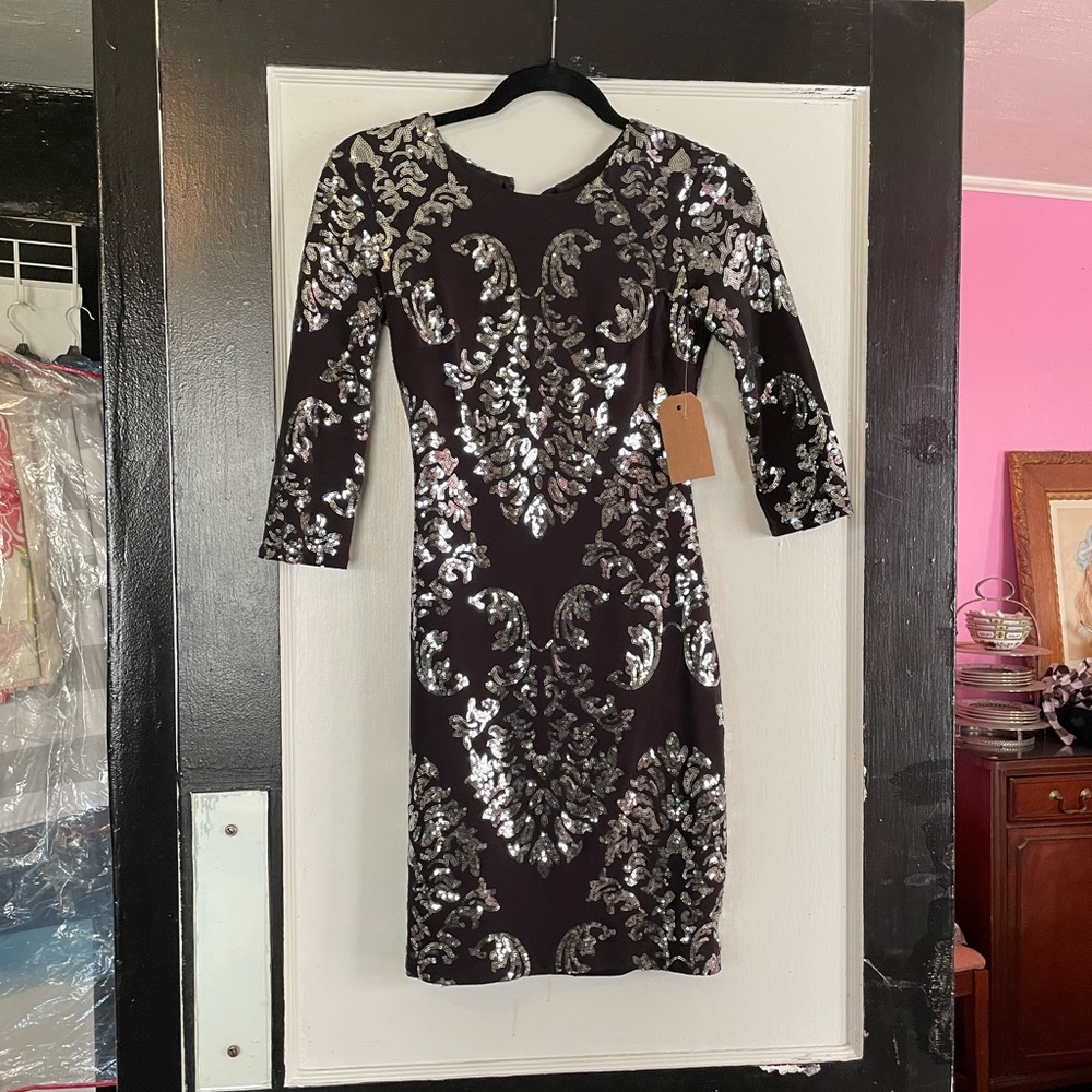 Black and silver sequins. Perfect condition